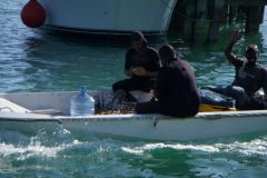 Local fishermen hawking conch & lobster