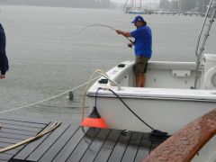 Boat neighbor Frank lands catfish during "Hurricane" Irene